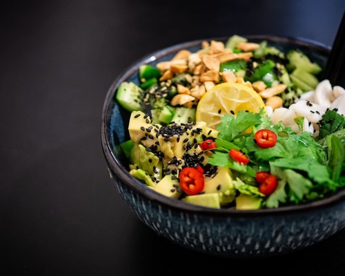 A fresh green salad with avocado and seeds
